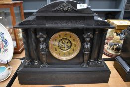A pre 1900 Victorian slate mantel clock, classical style monument design with Greek columns and a