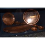 Eight pieces of Lakeland Rural Industries hand worked copper, including bowls dishes and large