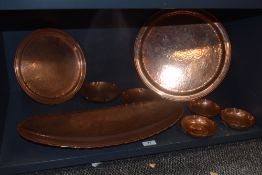 Eight pieces of Lakeland Rural Industries hand worked copper, including bowls dishes and large