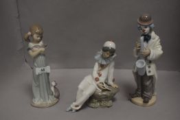 Modern figure studies including Lladro girl holding cat, Lladro Clown playing saxaphone and Nao