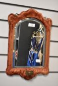 An early Victorian velvet framed mirror having cut glass and candle sconce attached.