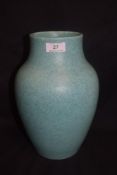 An Arts and Crafts era Pilkingtons Royal Lancastrian studio pottery vase in a green mottle glaze no.