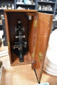 A vintage Beck London Model 47 scientific microscope with fitted case