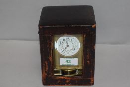 An antique French carriage clock having brass case with bevel edged glass panels and visible