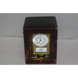 An antique French carriage clock having brass case with bevel edged glass panels and visible