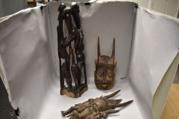 Two early 20th century African tribal hard wood carved masks of indigenous design with a carved wood