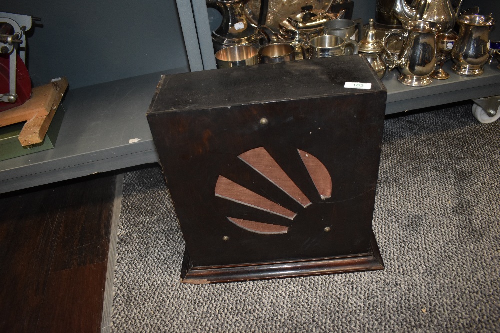 An Art Deco speaker and cabinet with a star burst design.