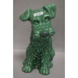A mid century Sylvac figure study of a green dog model 1380