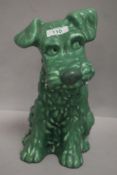 A mid century Sylvac figure study of a green dog model 1380