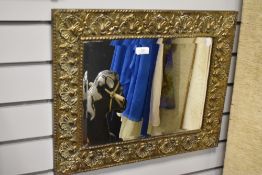 A Victorian Arts and Crafts era brass framed mirror