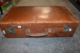 An early 20th century leather bound suit case with initials PMB to side