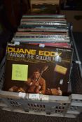 A box of approximately one hundred vintage vinyl albums of mixed genres