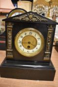 A Victorian Slate mantel clock with brass decals, and enamel dial