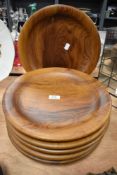 A set of six large wooden plates 34cm wide