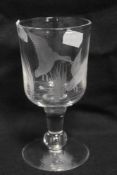 A modern hand made lead crystal wine glass goblet an individual piece wheel engraved with wild