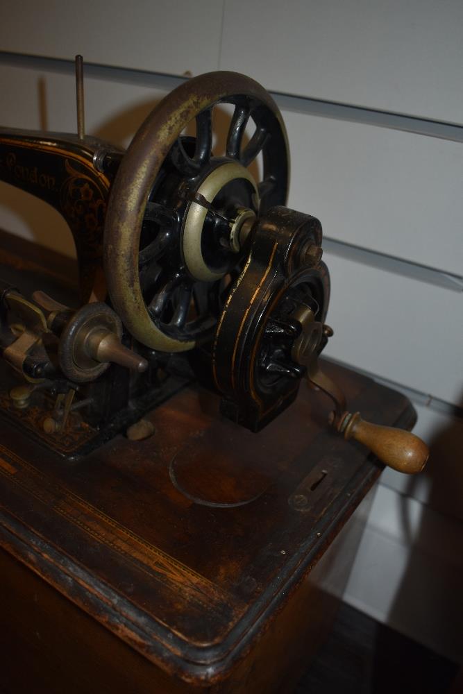 A Victorian Faudels London hand cranked sewing machine with fitted case - Image 3 of 3