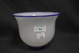 A modern Lindean Mill art glass bowl having white body with Bristol blue rim and foot signed to base