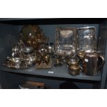 A selection of fine silver plated serving wares including tea set, gravy boats, tankards and