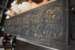 An antique hard wood carved panel removed from a palace in Orissa India, depicting fourteen