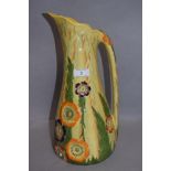 An early 20th century Carlton ware water jug having impressed and decorated floral design