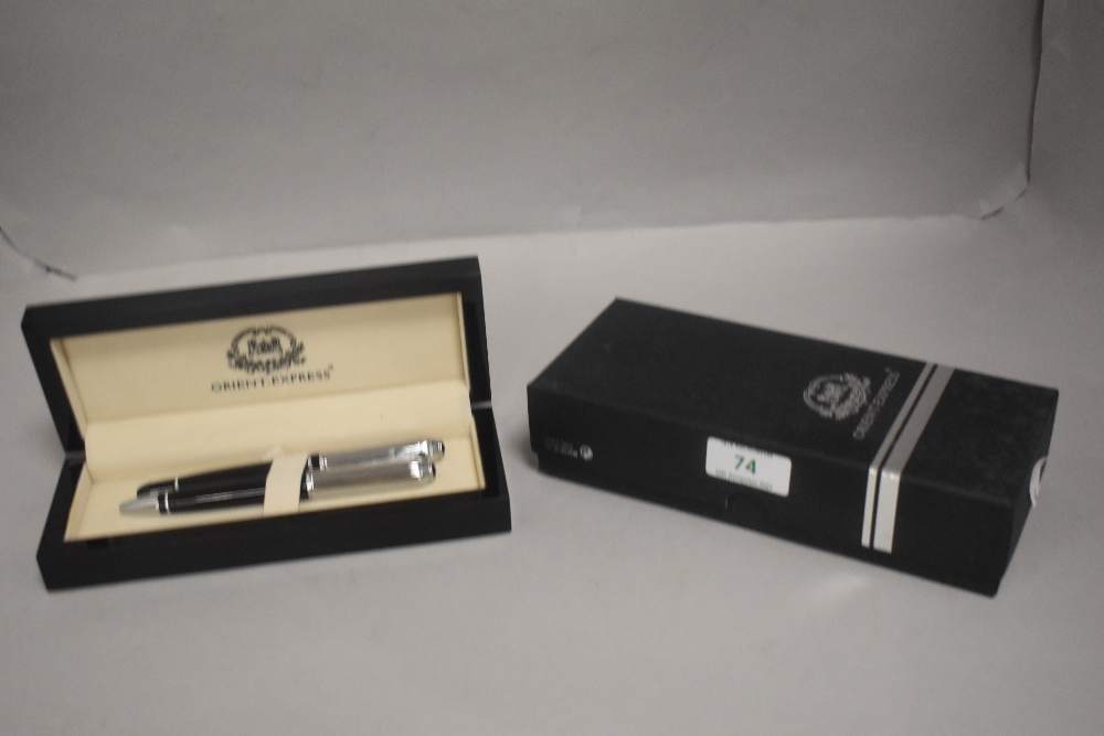 A modern Orient Express ball point pen set in black with chrome caps and original box.