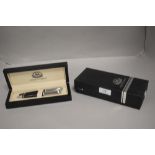 A modern Orient Express ball point pen set in black with chrome caps and original box.
