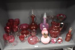 A fine selection of Victorian and later cranberry and ruby glass wares including, wine glasses,