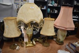 Two table top lamps including a brass cast example and an Art Deco style