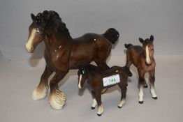 Three Beswick studies, Cantering Shire 975, Foals 951 & 1053, all brown