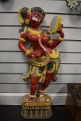 A 19th century Indian wood carved figure of a dancing girl or deity possibly Sri Lankan, stood