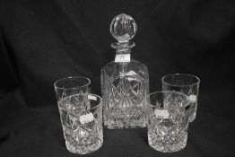 A modern Thomas Webb set of four tumblers with matching decanter.