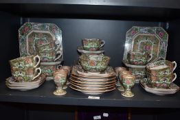 An early 20th century Chinese porcelain tea service in a typical Cantonese palette hand decorated