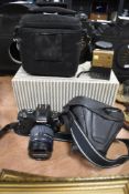 An Olympus E-410 digital camera with two lens and camera bag