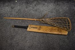 A 20th century La Crosse racket and a Gray Nicolls Steel Spring cricket bat