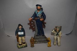 A collection of early 20th century and later maritime sailor items including door stop, penny