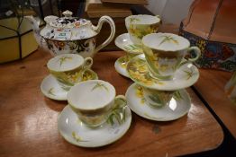 An early 20th century Shelley Foley imari pattern tea pot with six Shelley Daffodil tea cups and