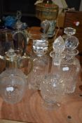 A fine selection of early 20th century clear cut glass decanters, and two claret jugs