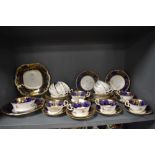 An early 20th century part tea service by Aynsley pat no. 13016 in a cobalt and gilt decoration