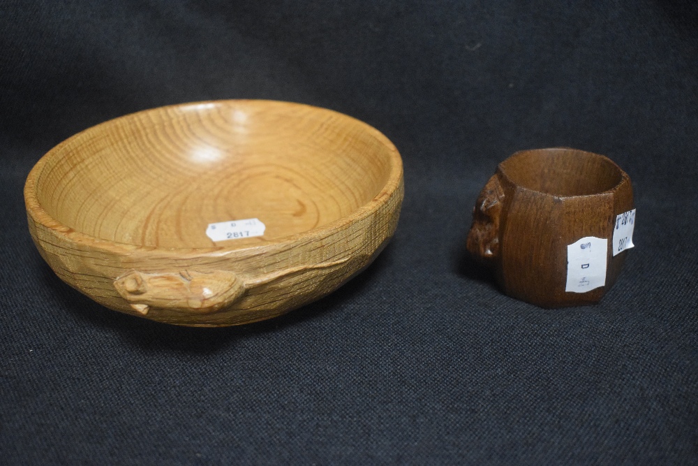 A Robert Thompson Mouseman Yorkshire Oak carved Nut Bowl with a Napkin ring, both bearing a carved