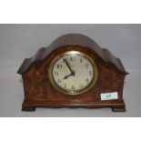 An early 20th century mantel clock having scroll work style case and 8 day movement