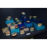 A good selection of modern pill cases or snuff boxes including Halcyon Days, Bilston enamels and