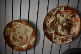Two 19th century Japanese chargers in a traditional satsuma palette with decoration of samurai and