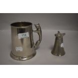 An early 20th century stirrup cup having a fox form base along with a fox handle tankard