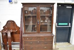 A Victorian stained bookcase having drawer base