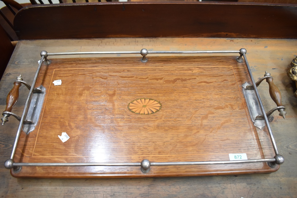 An Edwardian oak tray having inlay detailing