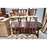 A set of six 'Fleur de Lys' style ercol kitchen dining chairs, dark stained