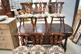 A set of six 'Fleur de Lys' style ercol kitchen dining chairs, dark stained