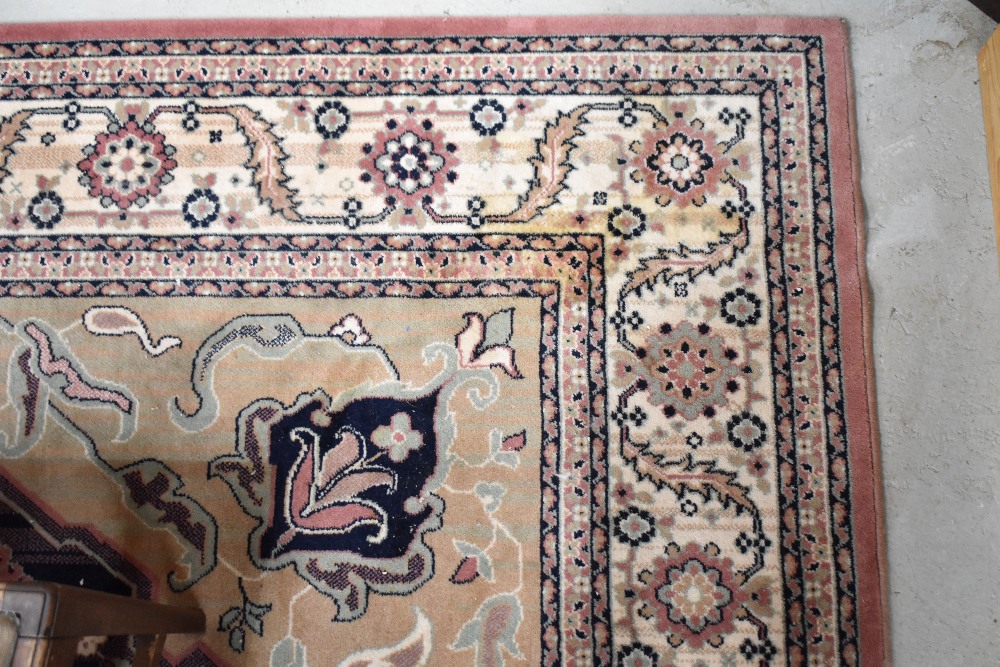 A Chinese room size carpet square, approx 340 x 243cm, with cream , jade and pink tones