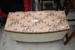 A vintage woven fibre bedding box