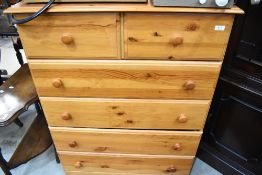 A modern pine chest of two over four drawers